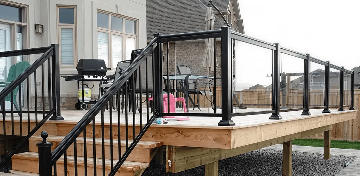 Handrail installation on a deck staircase for safety and code compliance in Bakersfield, CA